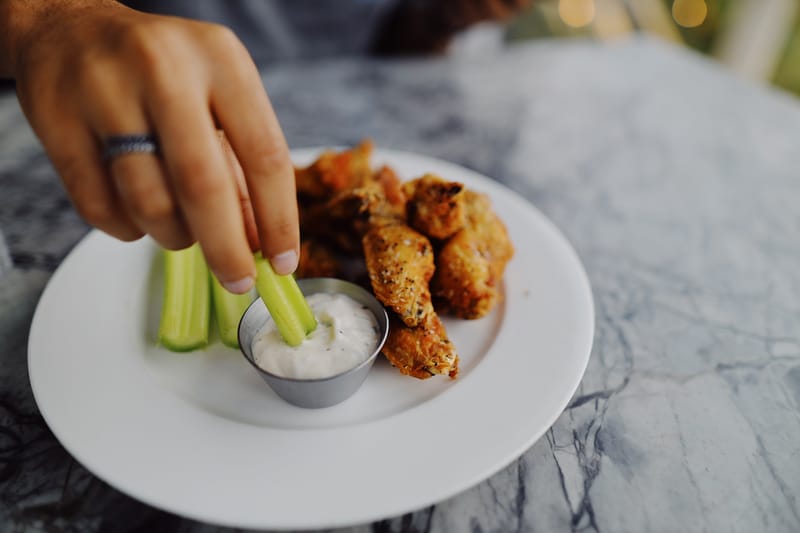 Crispy buffalo chicken wings with hot sauce